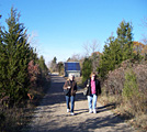 Betty and Jennifer on trail to point, solar collector behind