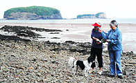 Betty and her dog with me on the Bay of Fundy shore